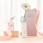 Boosters Pro facial device displayed with Pink Tomato Brightening Ampoule and packaging