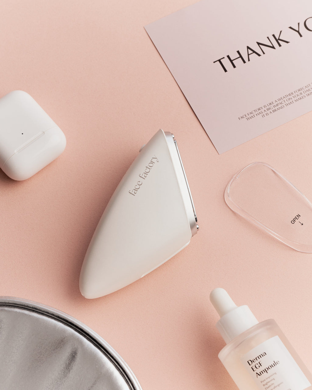 Face Factory Cell Liner skincare device shown in a flat lay setting