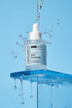 Derma EGF Ampoule serum bottle with water splash on a blue background