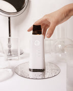 Face Factory's Galvanic Z-Water Peeling facial device with 24k gold plated spatula head in a water-based setting