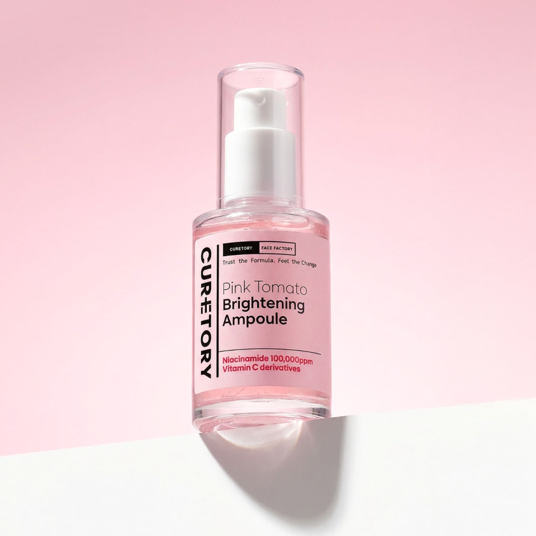 Face Factory's Pink Tomato Brightening Ampoule bottle on a soft pink background