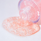 Pink Tomato Brightening Ampoule gel texture with visible pink capsules